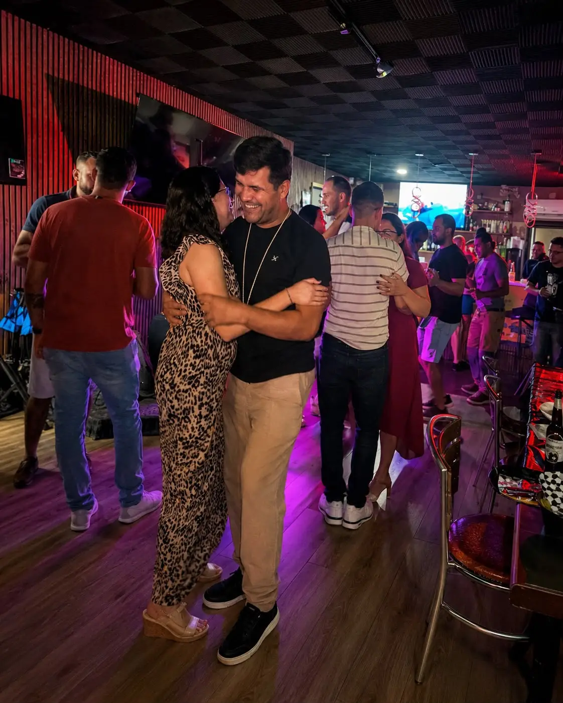 Couples dancing on the floor at Roots Bar